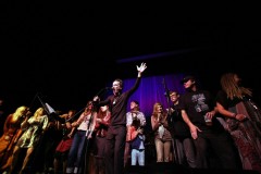 James Hall leads performers on stage at the Third Avenue Playhouse. Photo by Ty Helbach.