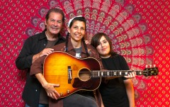 Marc, Paula, and Sam Intravaia with the John Lennon guitar